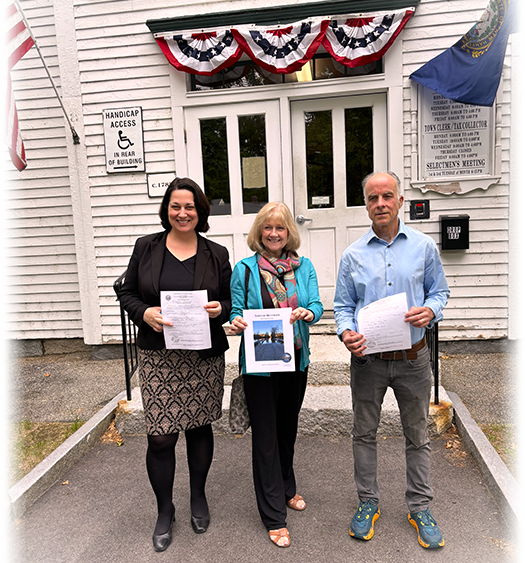 Stephanie, Eileen, and Tony outside Henniker town offices holding their filing applications