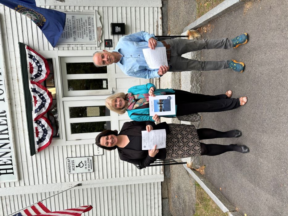 Stephanie, Eileen, and Tony outside Henniker town offices holding their filing applications